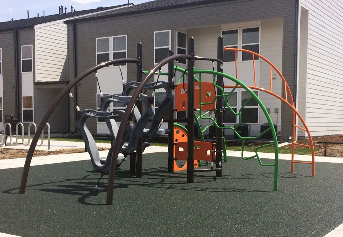 Arched metal playground at Sol Naciente
